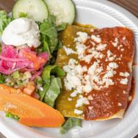 Enchilada Meal · Spicy. Two enchiladas with your choice of protein and sauce, topped with sour cream and serv...