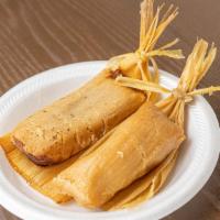2 Tamales & 2 Sides · Chicken or pork tamales smothered in your choice of salsa topped with sour cream and queso f...
