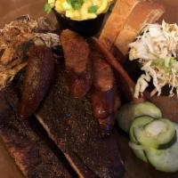2 Meat Plate · Choice of pork, chicken, brisket, or hot links. Served with two sides and Texas toast.