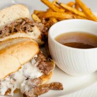 French Dip Sandwich · Per person. Shaved prime steak, Gruyere cheese, caramelized onions, horseradish cream, and A...