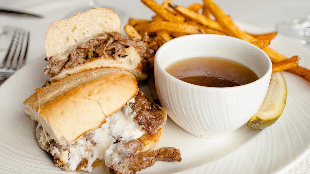 French Dip Sandwich · Per person. Shaved prime steak, Gruyere cheese, caramelized onions, horseradish cream, and Au Jus. Served with chips, pickles, and a chocolate chip cookie.