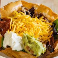 Taco Salad · Your choice of chicken or beef with romaine lettuce, tomatoes, cheddar cheese, and onions.  ...