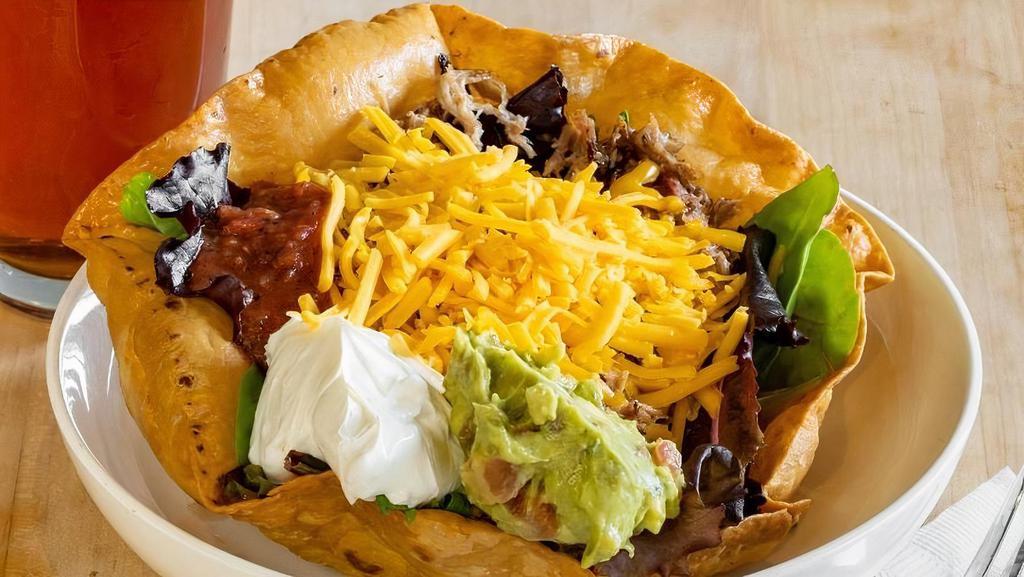 Taco Salad · Your choice of chicken or beef with romaine lettuce, tomatoes, cheddar cheese, and onions.  Sour cream, salsa,  and guacamole on the side.