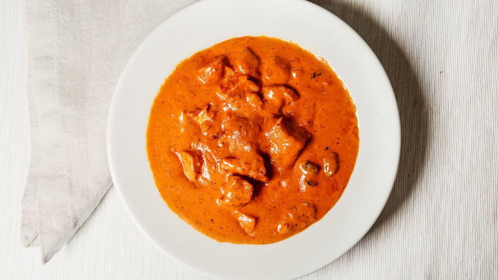 Butter Chicken (Sweet) · Roasted boneless chicken sautéed in spices with cream of tomatoes.