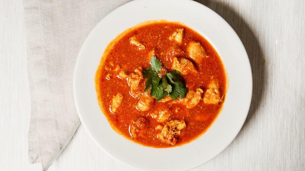 Chicken Curry · A traditional dish of Nepal carefully seasoned with an exotic blend of curry spices.