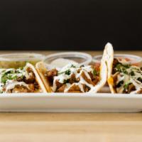 Chicken Tacos · Flour tortillas filled with your choice of chicken, shredded cheese, scallions, cilantro and...