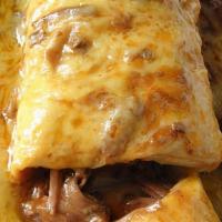 Burrito Colorado · Colorado classic. Beef braised in a mild red sauce, rice, and beans wrapped in a flour torti...