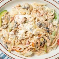 Pollo Con Crema · Tender chicken strips cooked in an authentic sour cream sauce with green peppers, onions, an...