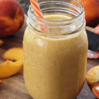 Punching Peach · Real Peaches, Banana, Choice of Protein, and Choice of Smoothie Base.
(Contains Dairy)
(Non-...