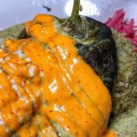 Crab & Shrimp Rellano · Roasted poblano pepper, Crab and Shrimp, Green Sauce, Guajillo Sauce, black beans, cilantro ...