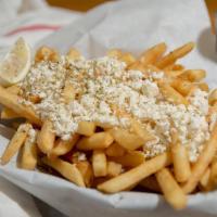 Greek Fries · French Fries, feta cheese, oregano, and lemon slices