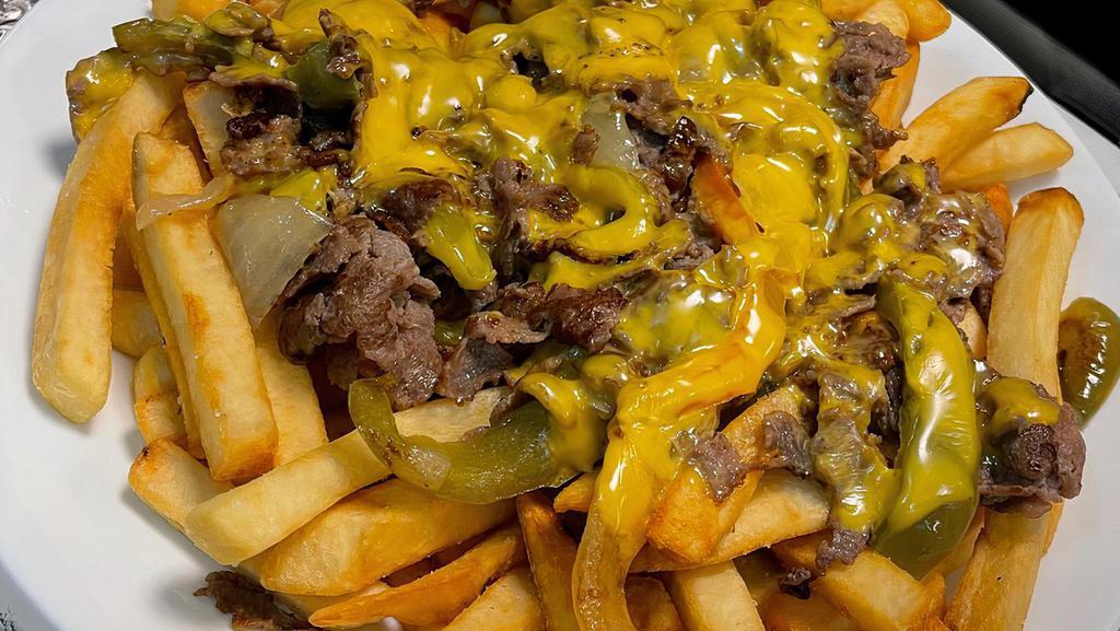 Loaded Philly Fries · French Fries, Philly Steak, grilled bell peppers, grilled onions, american cheese, and nacho cheese.