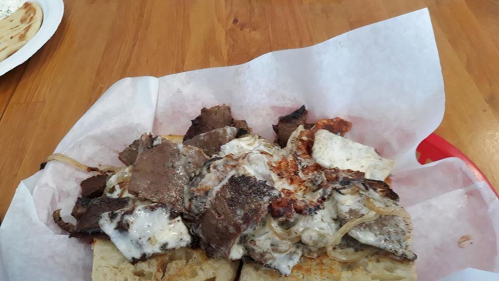 Philly Gyro · Gyro meat, grilled bell pepper, grilled onions, and philly sauce.