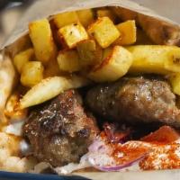 Bifteki Pita Wrap · Homemade seasoned ground beef patty, tomatoes, onions, lettuce, fries, and Tzatziki
