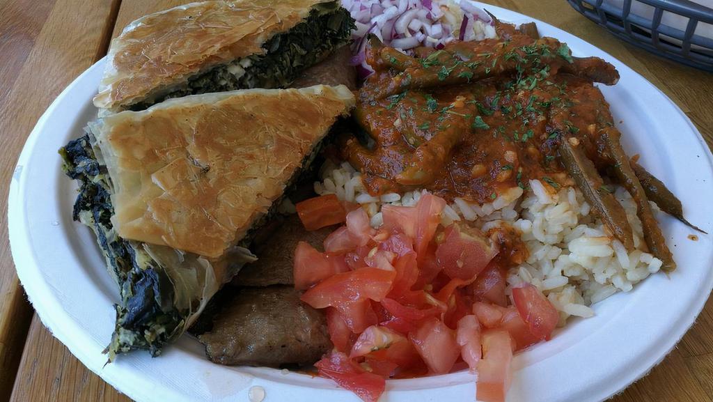Combo Souvlaki Entree Plate · Choice of Gyro meat, grilled chicken, or spanakopita served with rice, Greek-Style green beans, onions, tomatoes, pita bread, and side of Tzatiki sauce.