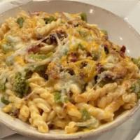 Half Loaded Mac: The Hatch · (lcebreak IPA) Spicy hatch green chilies, bacon, cheese sauce, shredded cheese, and bread cr...