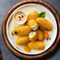 Jalapeno Jitter Poppers · (Vegetarian) Fresh jalapenos coated in cream cheese and fried until golden brown.
