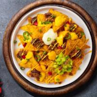 Nerdy Nachos · (Vegetarian) Salted tortilla chips doused in melted nacho cheese.