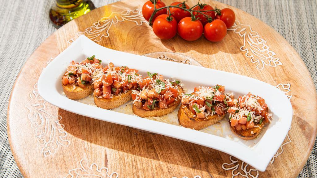 Bruschetta With Tomato & Basil · A mixture of chopped tomatoes, fresh basil, fresh garlic, balsamic vinaigrette, spooned over olive-oil slices of toasted baguette, topped with parmesan cheese.