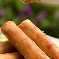 Egg Rolls (4) · Pork, loro, carrots, cabbage, and bean thread noodles rolled in rue paper and fried to o gol...