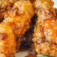Honey Garlic Wings · wings and drummettes fried  with honey garlic sauce