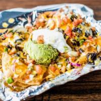 Nachos · Chips, Cheese, black beans, tomatoes, onions, jalapeños, sour cream