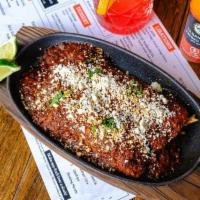 Enchiladas · Choice of filler, red enchilada sauce, queso fresco, choice of two (2) sides