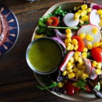 Side Salad · Mixed greens, tomato, onion, corn, radish, cilantro-lime vinaigrette