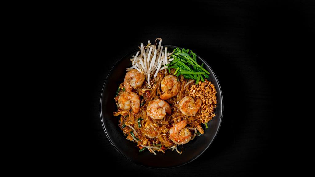 Pad Thai · Stir-fried noodle with egg, bean sprouts, chives and crushed peanuts on the side. Served with your choice of protein.