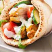 Shawarma Chicken · Marinated grilled layers of chicken breasts.