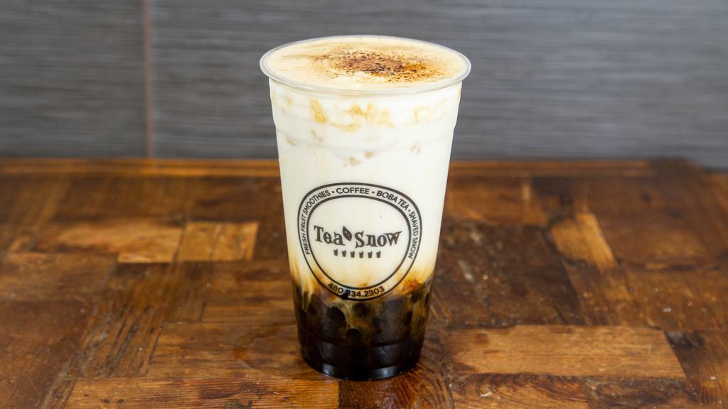 Golden Bubble Milk · Brown sugar boba with fresh milk layered with sea salt cream and topped with caramelized brown sugar.