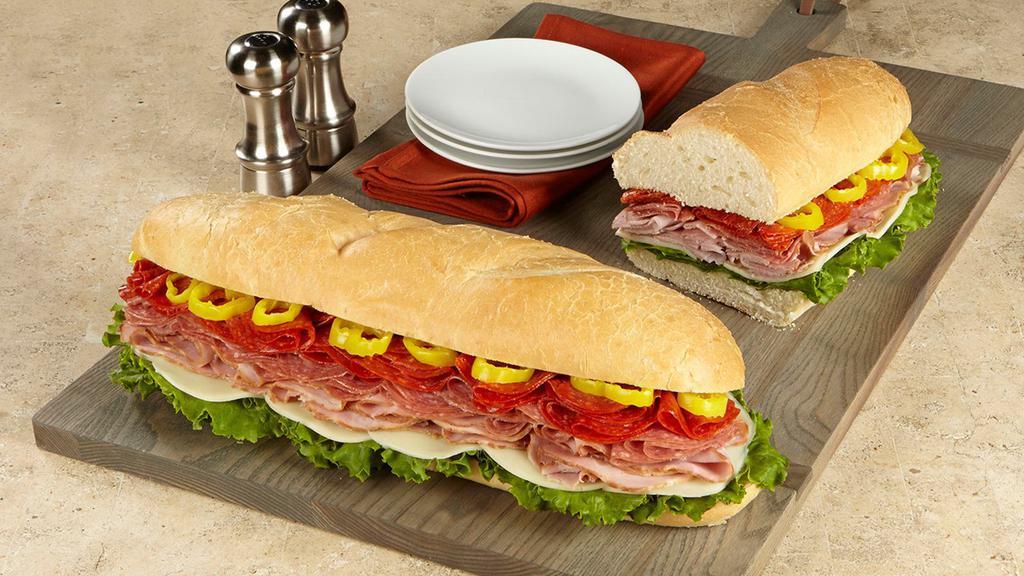Italian Super Sub Sandwich · Honey Ham, Hard Salami, Pepperoni, Provolone, Pepperoncini & Leaf Lettuce on Scratch Made French Bread. No substitutions.