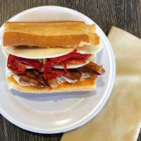 Chipotle Turkey · In-House Turkey, Bacon, Provolone, Red Peppers, Caramelized Onions & Chipotle Mayo.