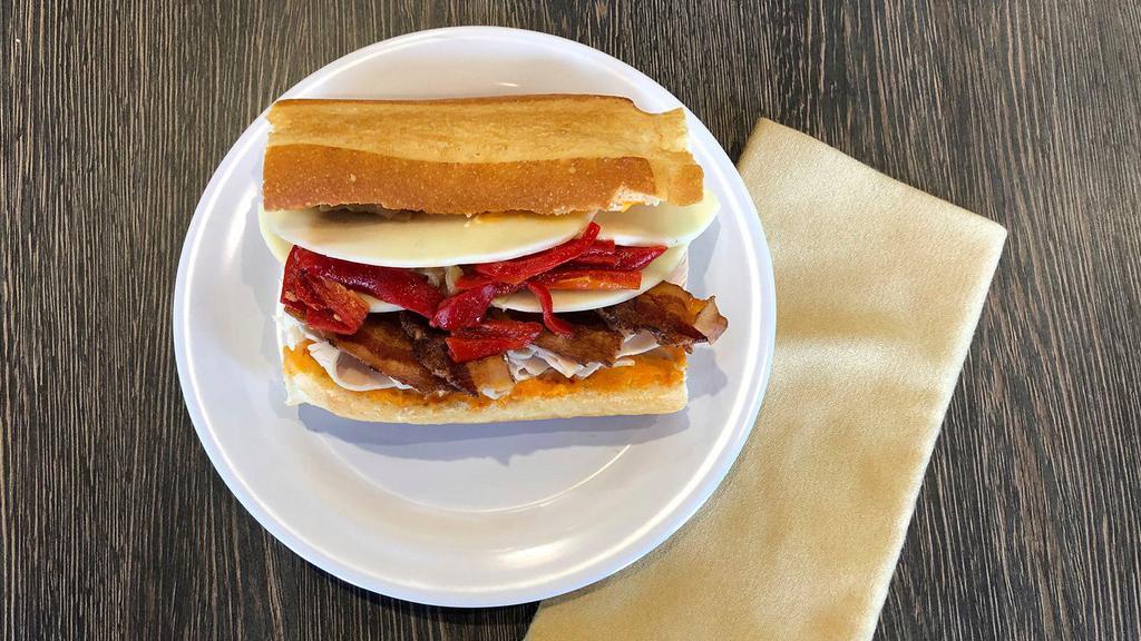 Chipotle Turkey · In-House Turkey, Bacon, Provolone, Red Peppers, Caramelized Onions & Chipotle Mayo.