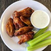 Bone-In Buffalo Wings · Bone-In Wings Tossed in a Spicy Buffalo Sauce. Served with Your Choice of Blue Cheese or Ran...