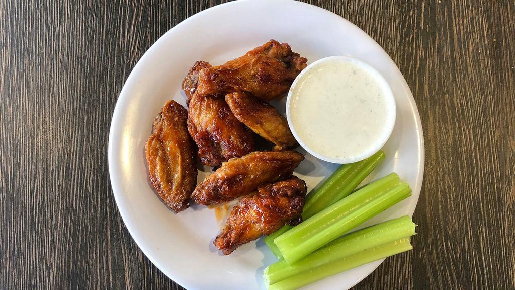 Bone-In Buffalo Wings · Bone-In Wings Tossed in a Spicy Buffalo Sauce. Served with Your Choice of Blue Cheese or Ranch.