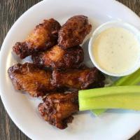 Bone-In Bbq Wings · Bone-In Wings Tossed in a Sweet and Tangy BBQ Sauce. Served with Your Choice of Blue Cheese ...