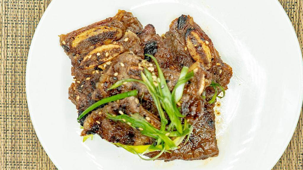 “Kalbi” Short Ribs · Sliced Korean style marinated beef ribs.