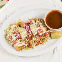 Tacos Dorados (4) · Lettuce, tomato, cucumber, avocado, onion, cotija cheese, and sour cream. with a side of bee...