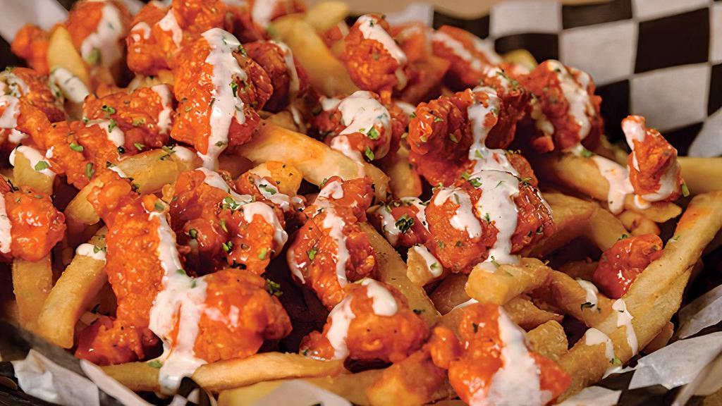 Buffalo Ranch Fries · Chicken dipped in buffalo ranch seasoning on top of seasoned fries, covered with our special sauce.