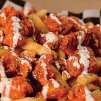 Bbq Buffalo Fries · Chicken dipped in BBQ wing sauce on top of seasoned fries, covered with our special sauce.