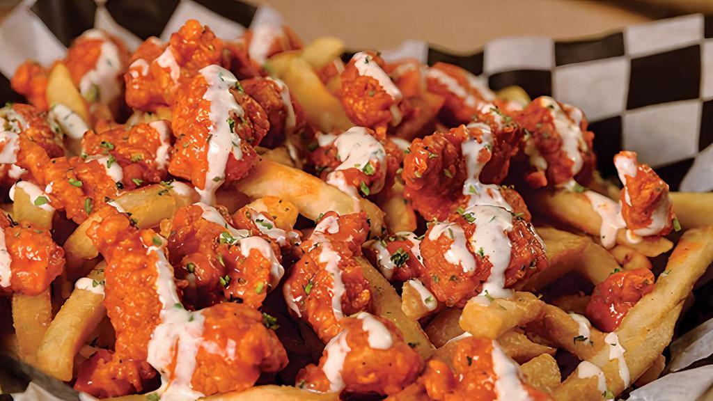 Bbq Buffalo Fries · Chicken dipped in BBQ wing sauce on top of seasoned fries, covered with our special sauce.