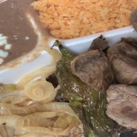 Asada Plate · Beef steak served with rice, beans and corn tortillas.