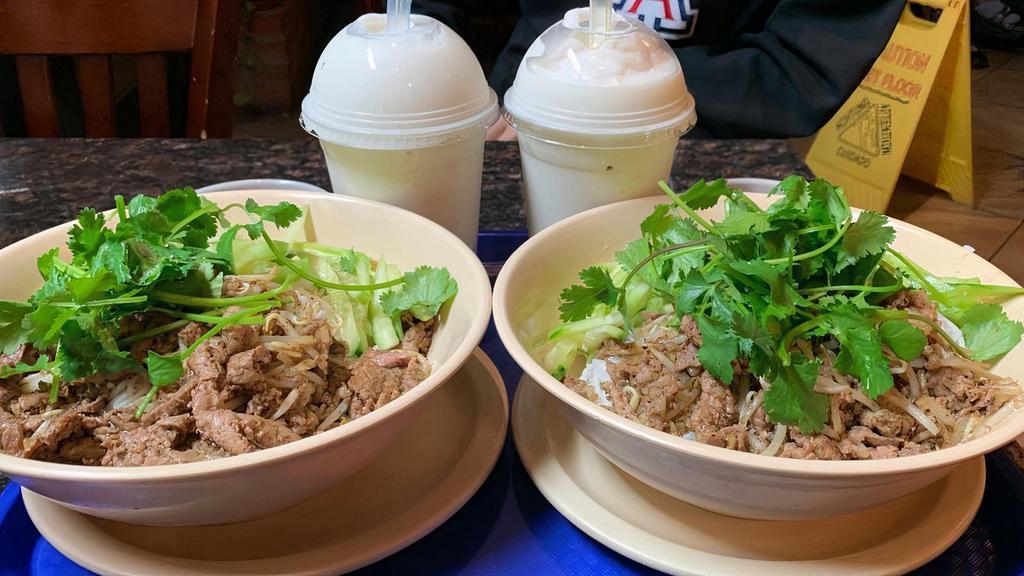 Bún Bò Xào - Lemongrass Beef / Chicken Bun · Choice of sliced tender beef or chicken sautéed with bean sprouts lemongrass and onions over vermicelli cucumber slices and cilantro. Served with chili lime fish sauce.