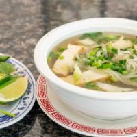 Phở Gà - Chicken Rice Noodle Soup · Tender white chicken slices in a rich stock with sweet onion and cilantro rice noodles.