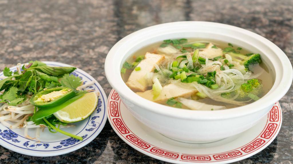 Phở Gà - Chicken Rice Noodle Soup · Tender white chicken slices in a rich stock with sweet onion and cilantro rice noodles.