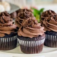 Double Chocolate Cupcake (1) · A chocoholics dream! A rich, chocolate cake topped with a chocolate buttercream and garnishe...