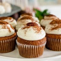 Carrot Cake Cupcake (1) · A moist cupcake made with real shredded carrots, golden raisins and spiced with cinnamon, gi...