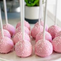 Strawberry Cake Pop · Strawberry cake dipped in a strawberry infused white chocolate and accented with white sprin...