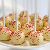 Lemon Raspberry Cake Pop · Lemon cake combined with raspberries extract then dipped in a pale yellow white chocolate an...